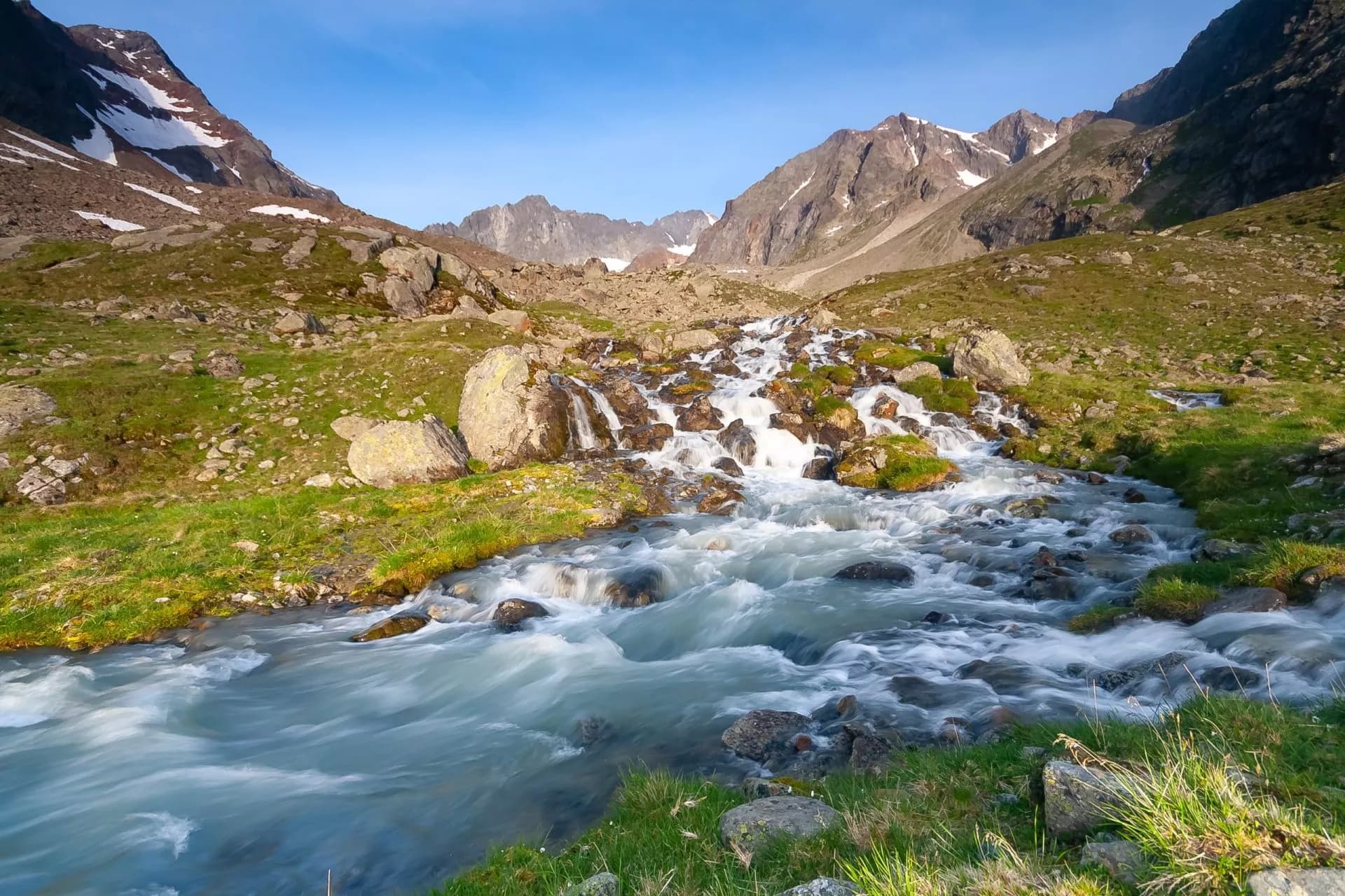 Fresh stream in river coming from glaciers up the valley near Neue Regensburger huette, Stubai Tyrol Alps, Austria