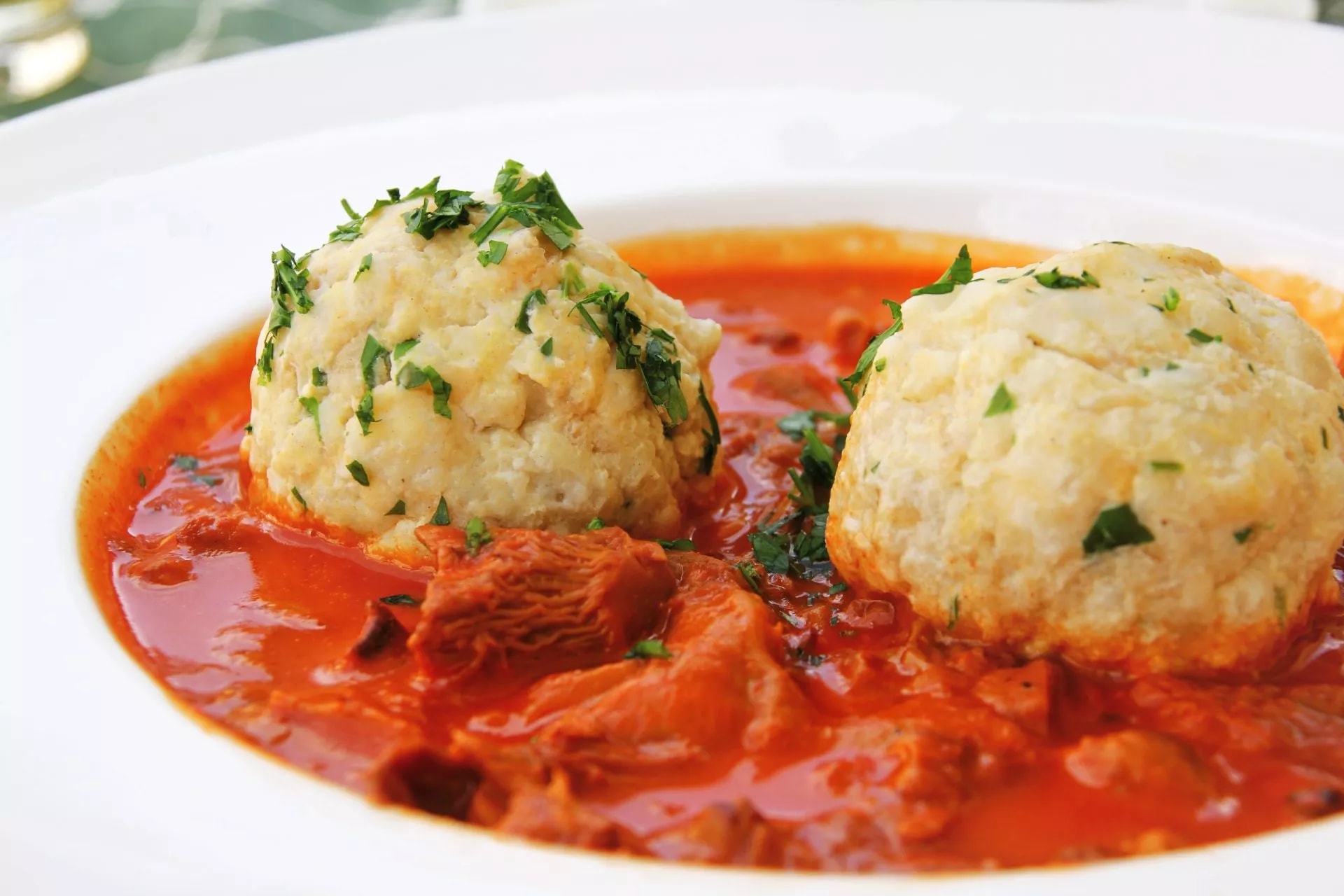 Austrian food specialty: bread dumpling with chanterelle mushroom goulash